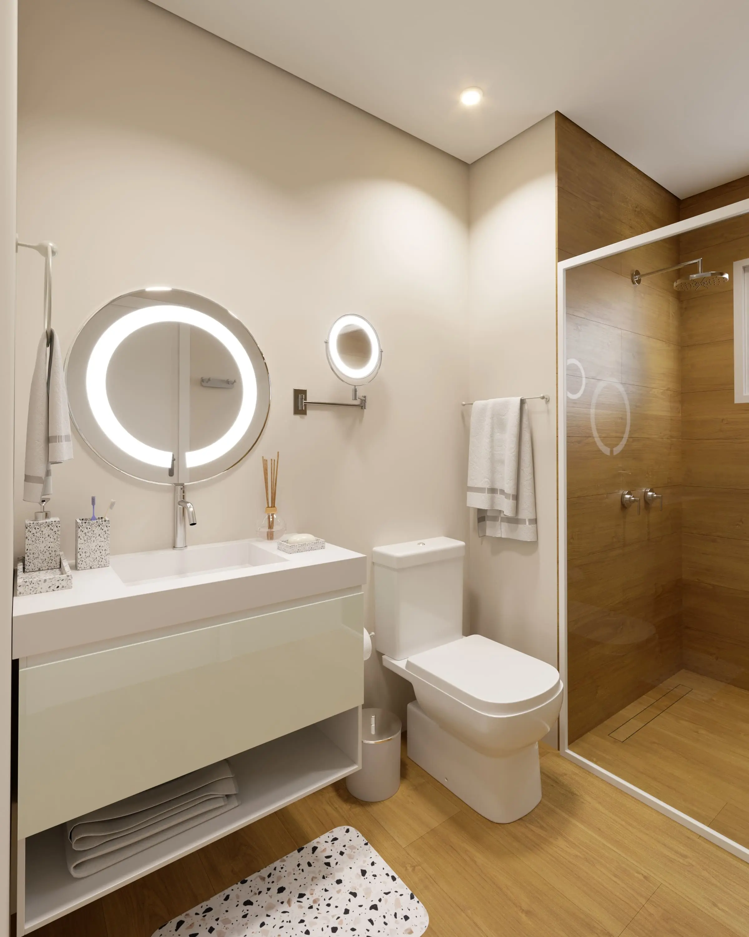 Banheiro da suíte com box de vidro, bancada e revestimento em porcelanato
